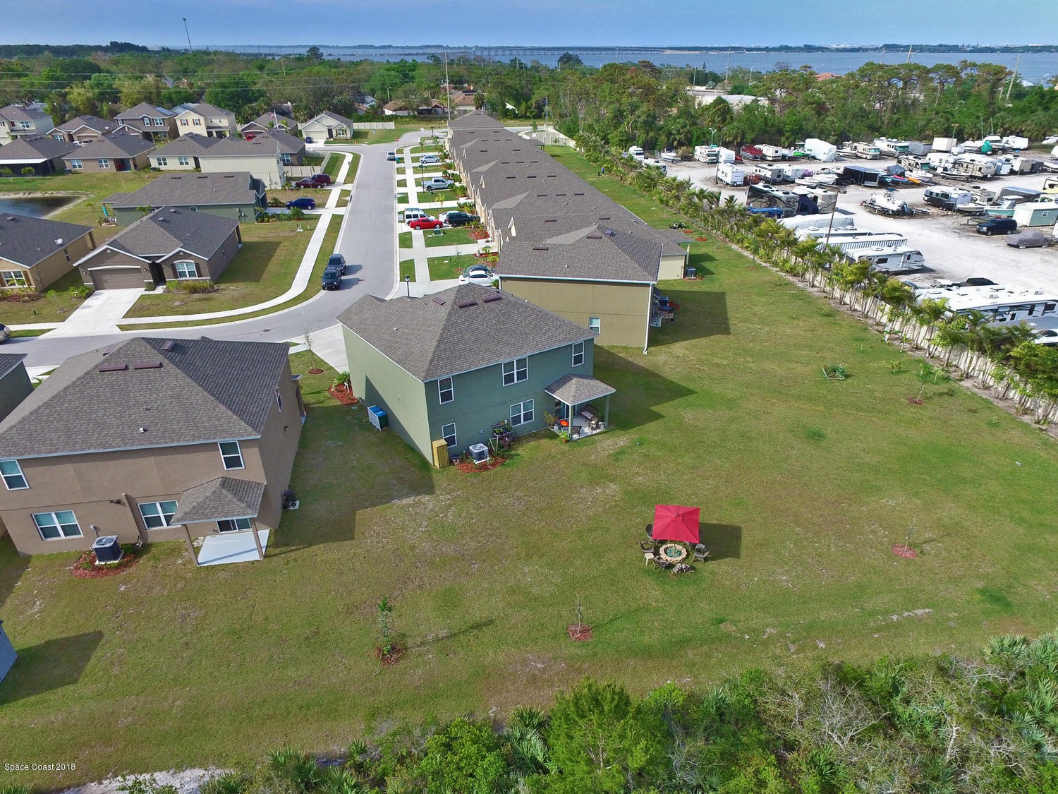 4637 Amaca Bay Lane Melbourne, FL 32935 - Photo 34 of 52 an aerial view of residential houses with outdoor space