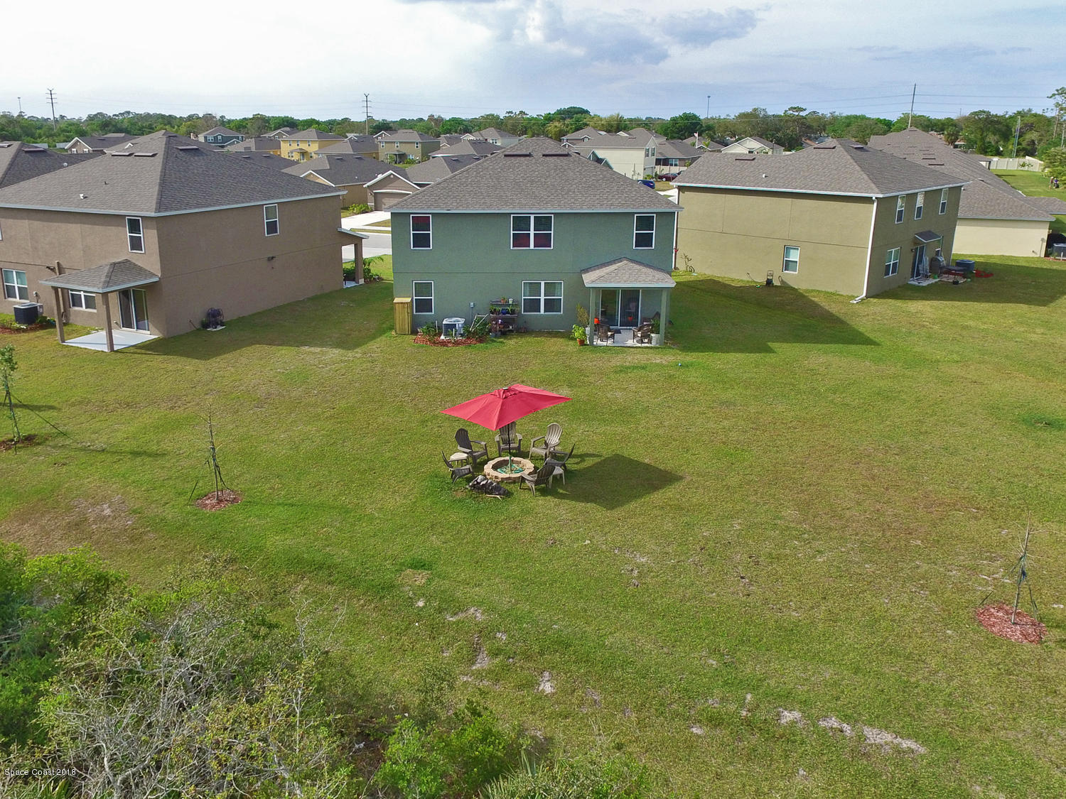 4637 Amaca Bay Lane Melbourne, FL 32935 - Photo 35 of 52 an aerial view of a house with a yard