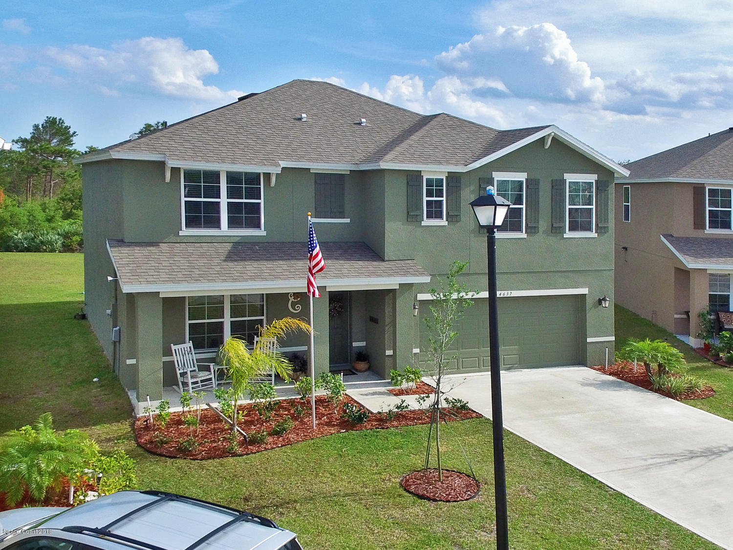 4637 Amaca Bay Lane Melbourne, FL 32935 - Photo 37 of 52 a front view of a house with garden