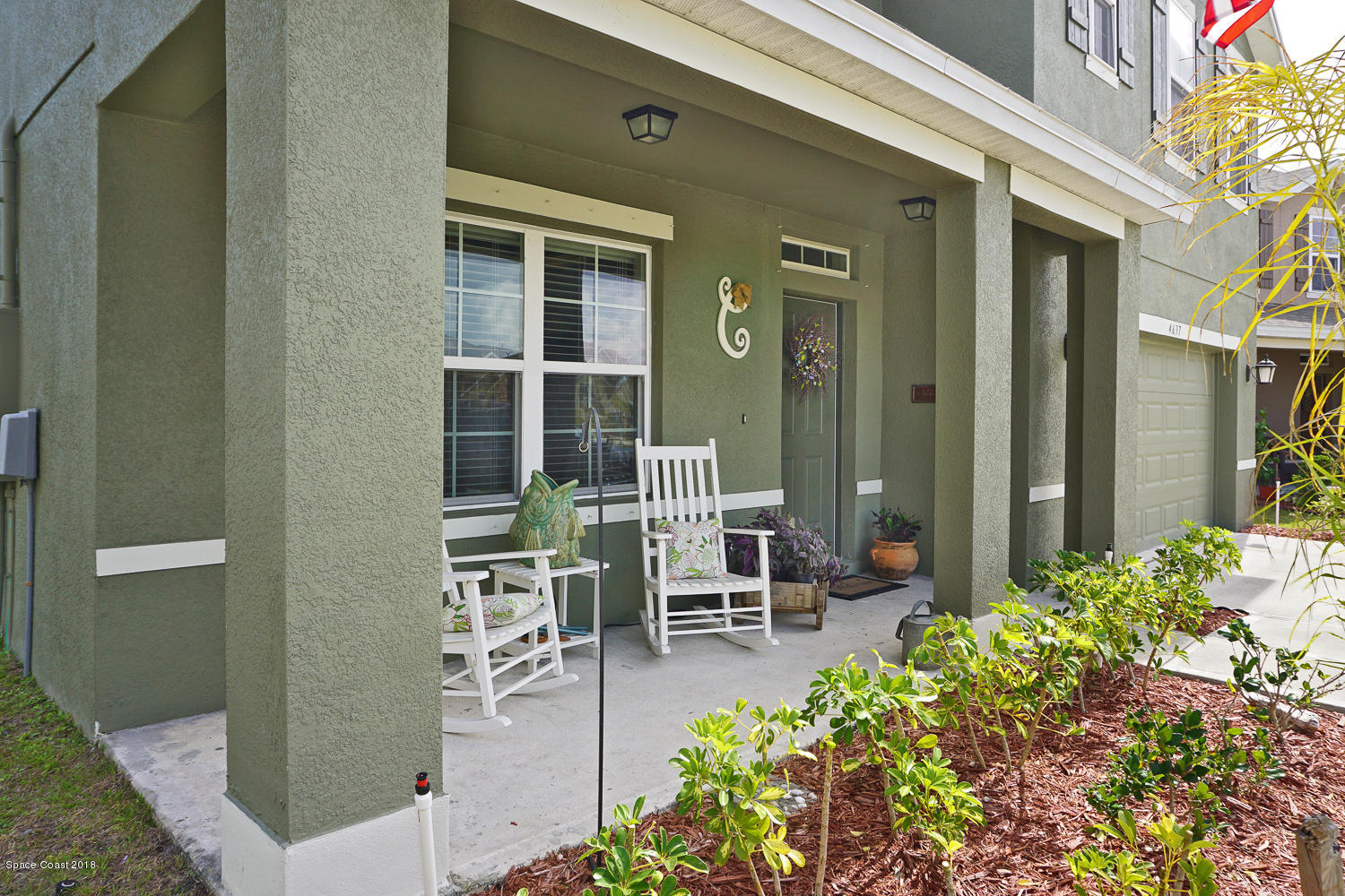 4637 Amaca Bay Lane Melbourne, FL 32935 - Photo 38 of 52 a view of a patio with table and chairs and potted plants