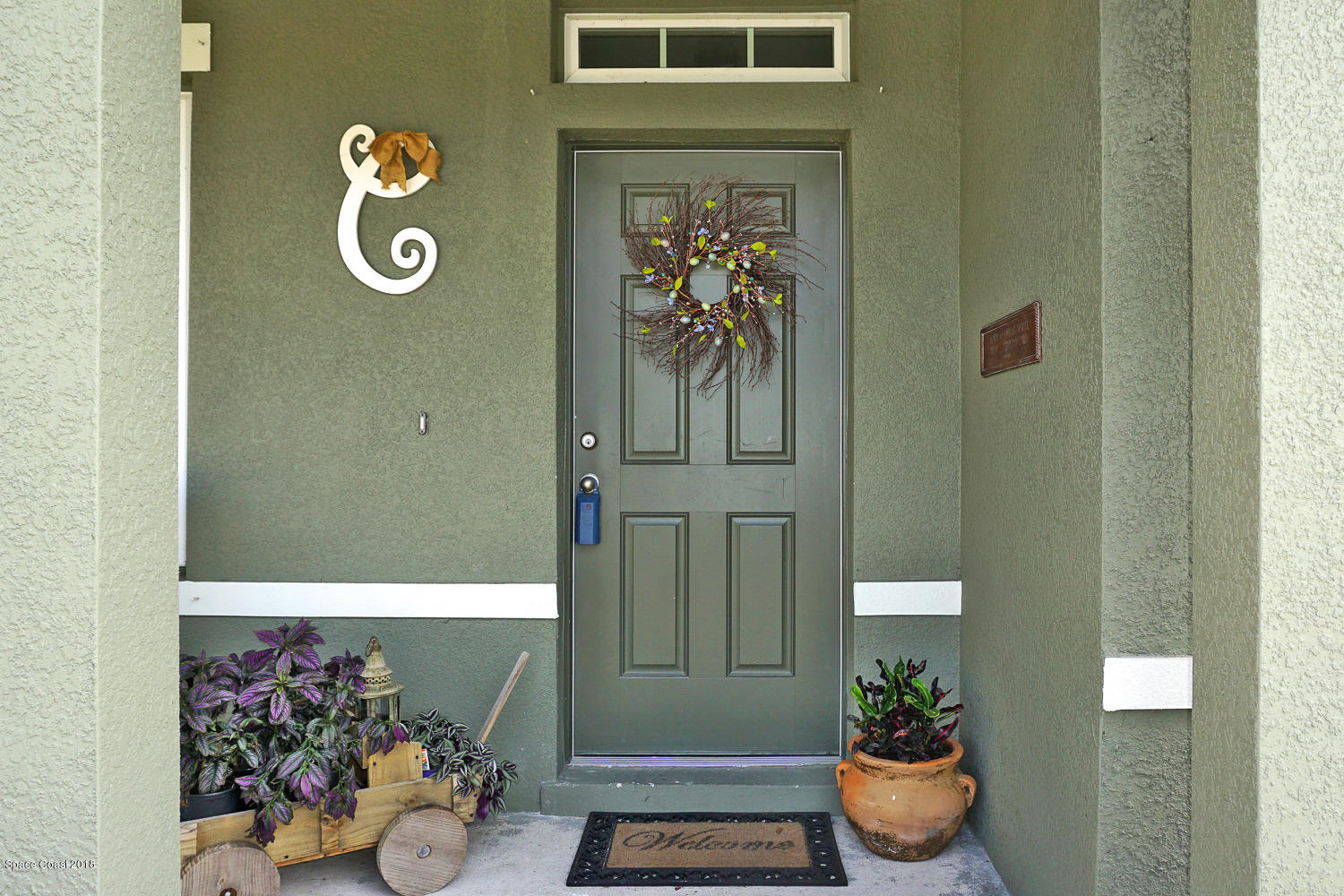 4637 Amaca Bay Lane Melbourne, FL 32935 - Photo 39 of 52 a view of a entryway door of the house