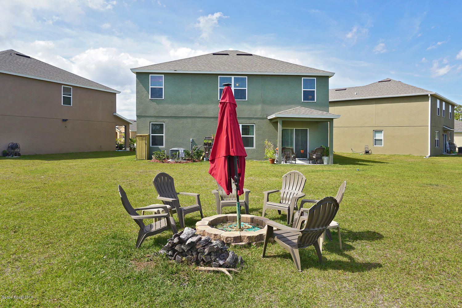 4637 Amaca Bay Lane Melbourne, FL 32935 - Photo 40 of 52 a view of a chair and table in backyard of the house