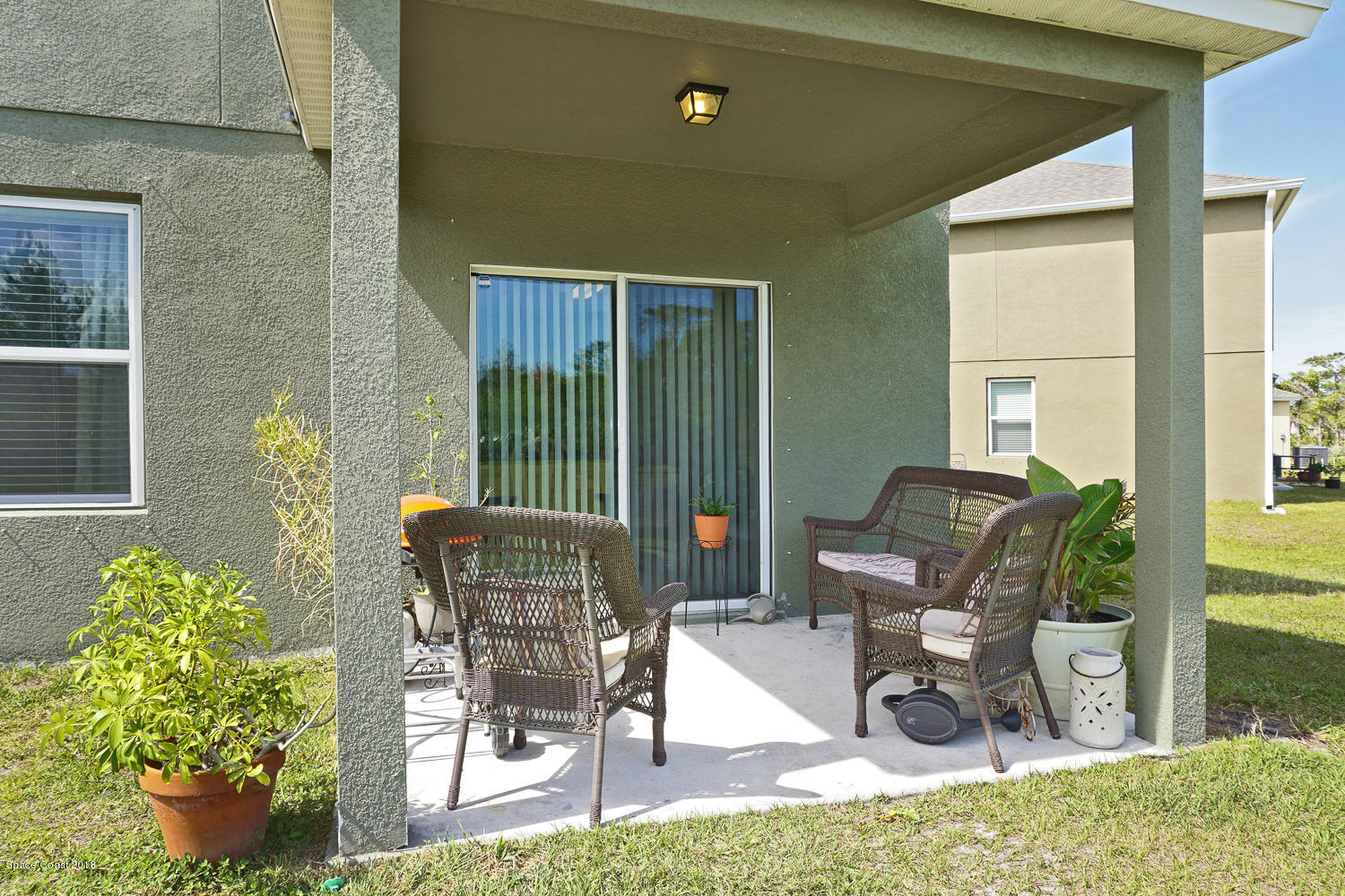4637 Amaca Bay Lane Melbourne, FL 32935 - Photo 43 of 52 a building outdoor space with seating space