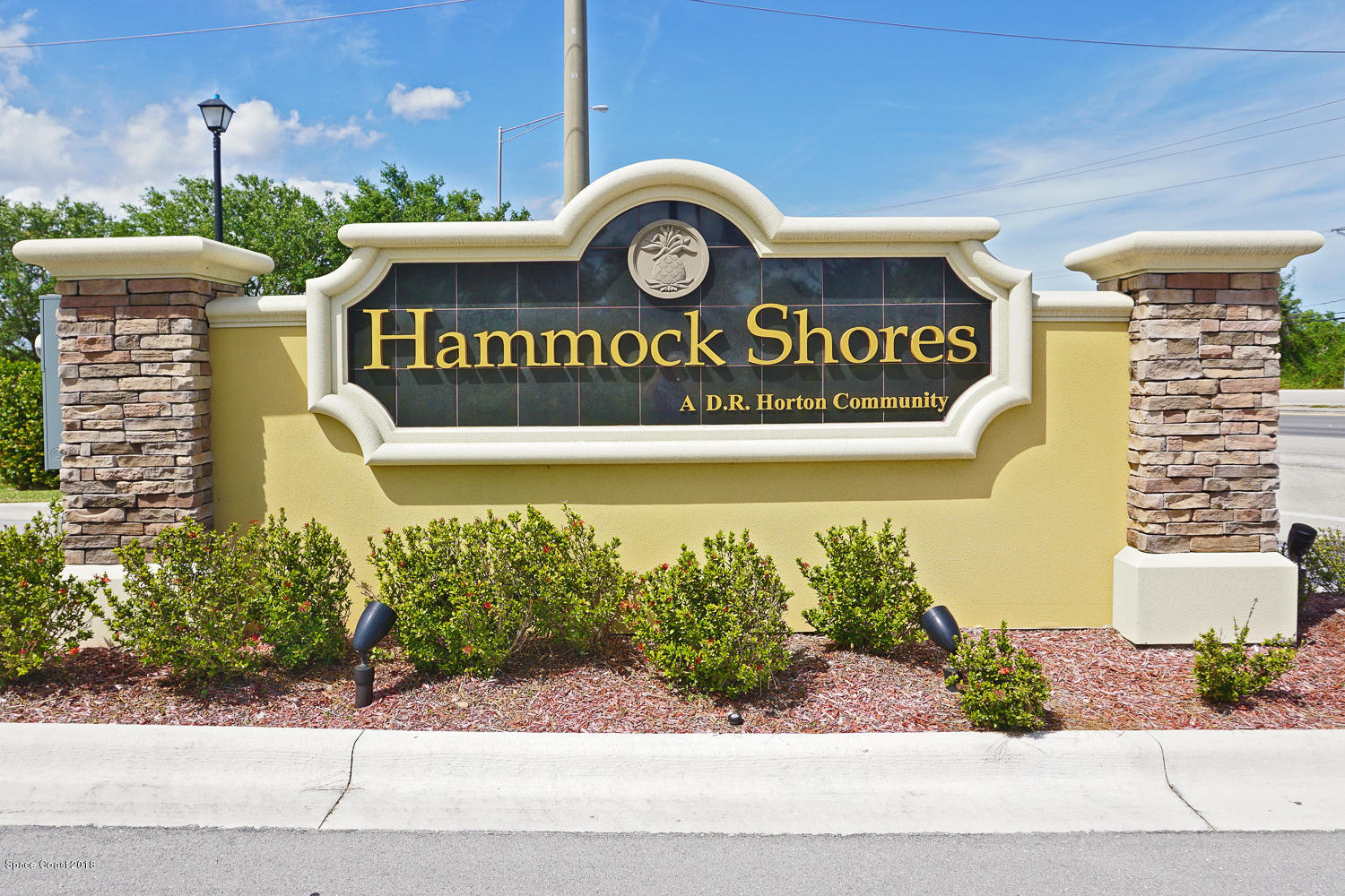 4637 Amaca Bay Lane Melbourne, FL 32935 - Photo 44 of 52 a view of outdoor space with signage and flags