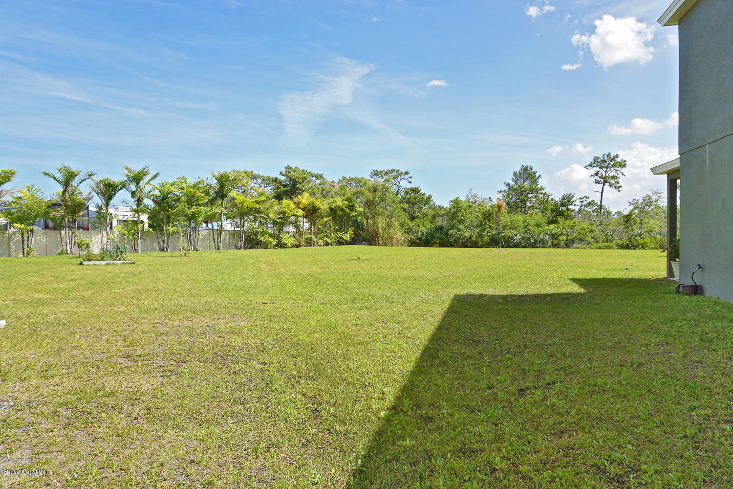 4637 Amaca Bay Lane Melbourne, FL 32935 - Photo 45 of 52 a view of a lake with a big yard