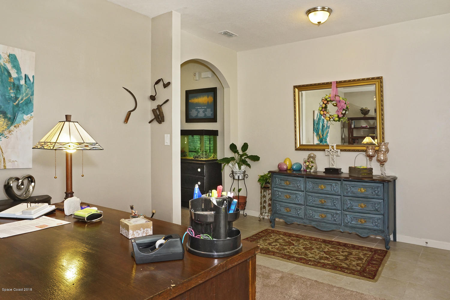 4637 Amaca Bay Lane Melbourne, FL 32935 - Photo 6 of 52 a living room with furniture and potted plants