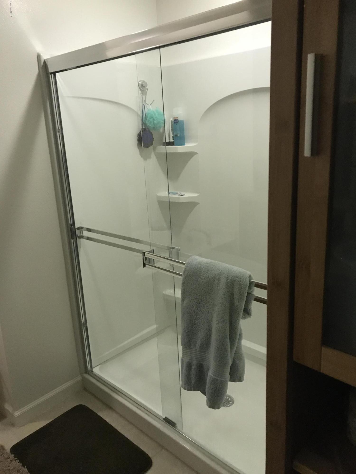 4637 Amaca Bay Lane Melbourne, FL 32935 - Photo 52 of 52 a bathroom with a shower