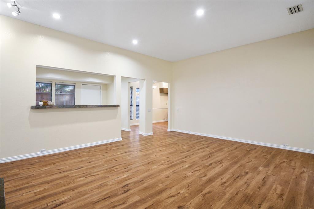 6512 Mc Cormick Ranch Court Plano, TX 75023 - Photo 14 of 40 a view of empty room with wooden floor and window
