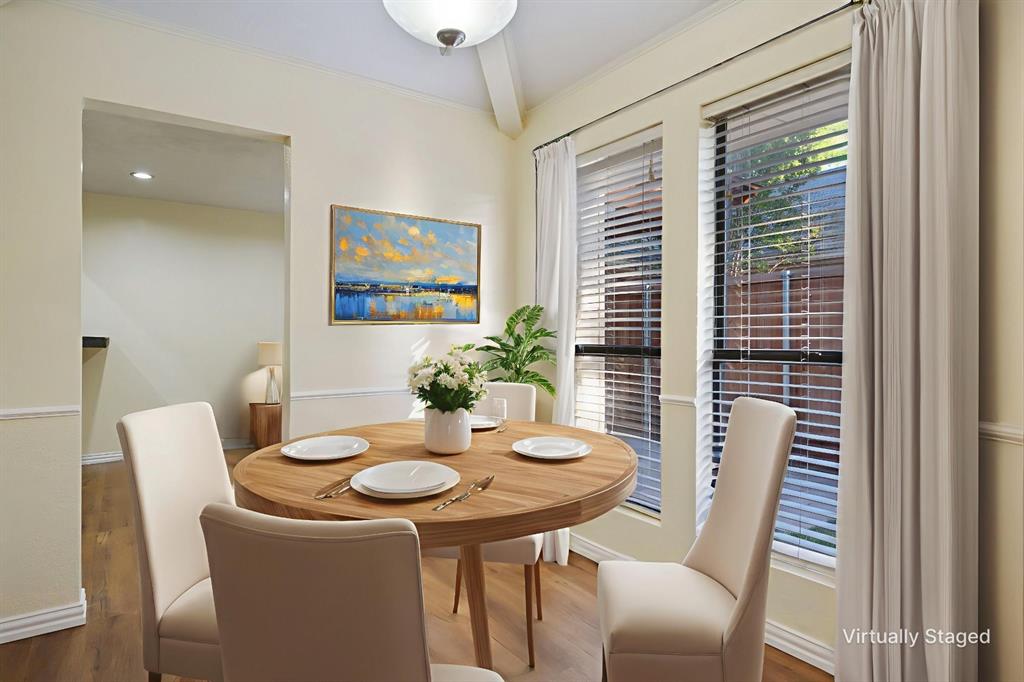 6512 Mc Cormick Ranch Court Plano, TX 75023 - Photo 17 of 40 a view of a dining room with furniture window and wooden floor