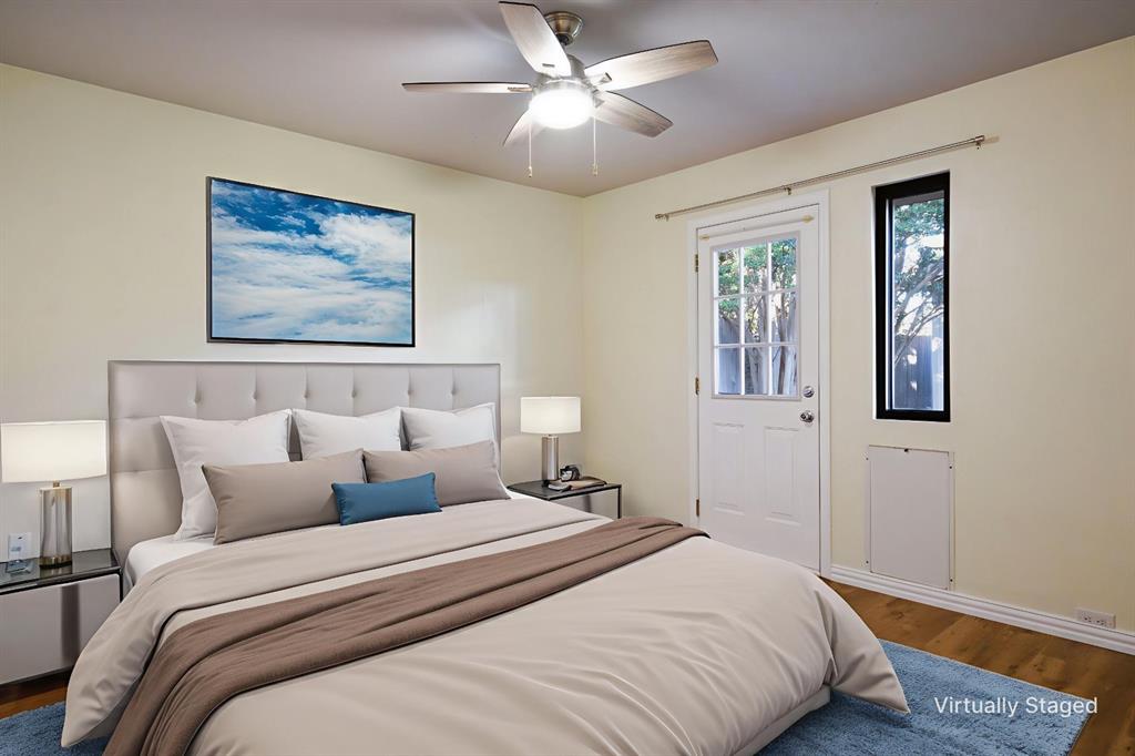 6512 Mc Cormick Ranch Court Plano, TX 75023 - Photo 22 of 40 a bedroom with bed and painting on the wall