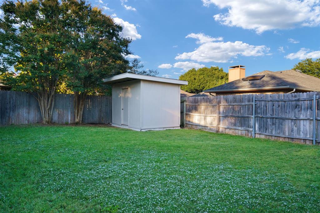6512 Mc Cormick Ranch Court Plano, TX 75023 - Photo 25 of 40 a view of a house with a yard and wooden fence