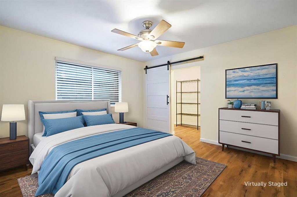 6512 Mc Cormick Ranch Court Plano, TX 75023 - Photo 7 of 40 a bedroom with a bed and a dresser