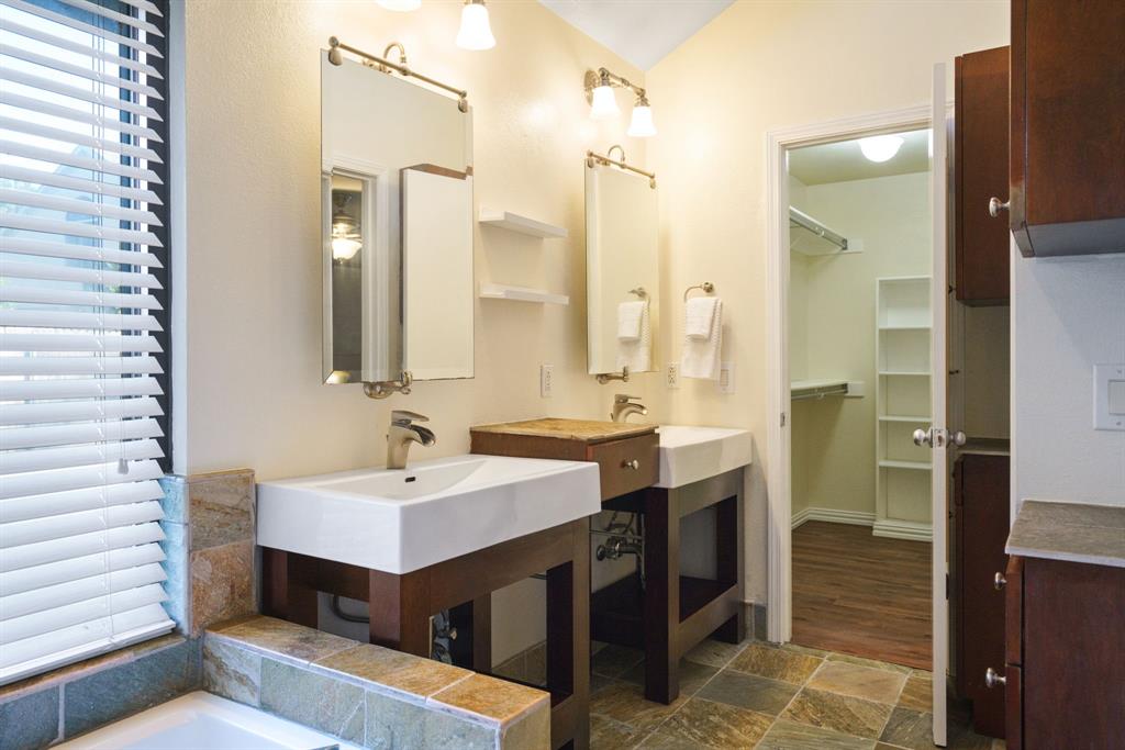 6512 Mc Cormick Ranch Court Plano, TX 75023 - Photo 9 of 40 a bathroom with a sink and a mirror