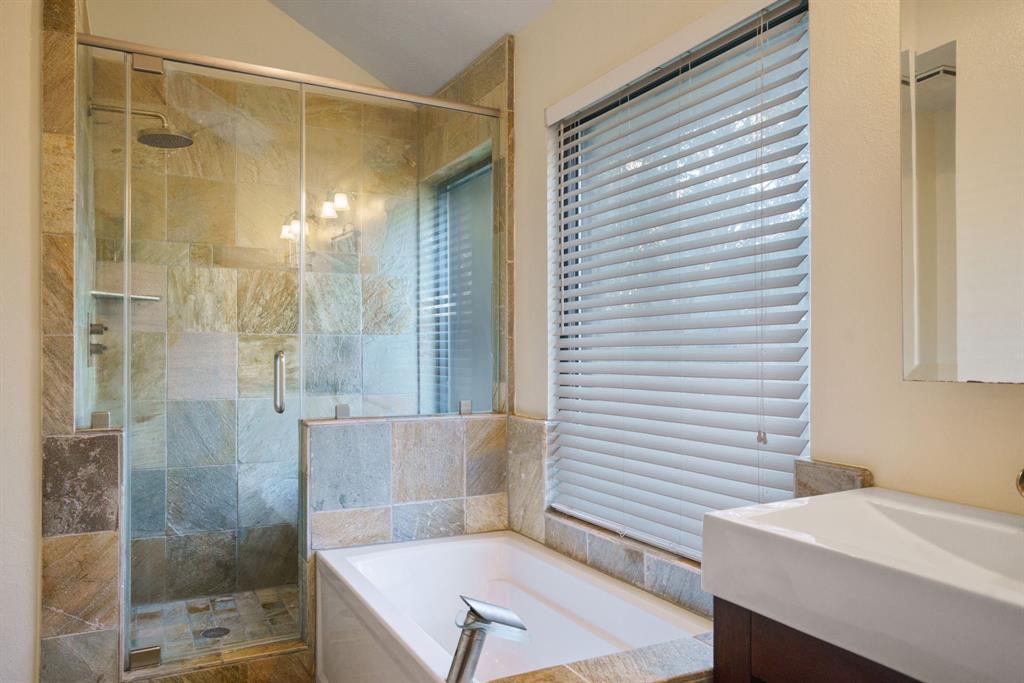 6512 Mc Cormick Ranch Court Plano, TX 75023 - Photo 10 of 40 a bathroom with a bathtub and a shower