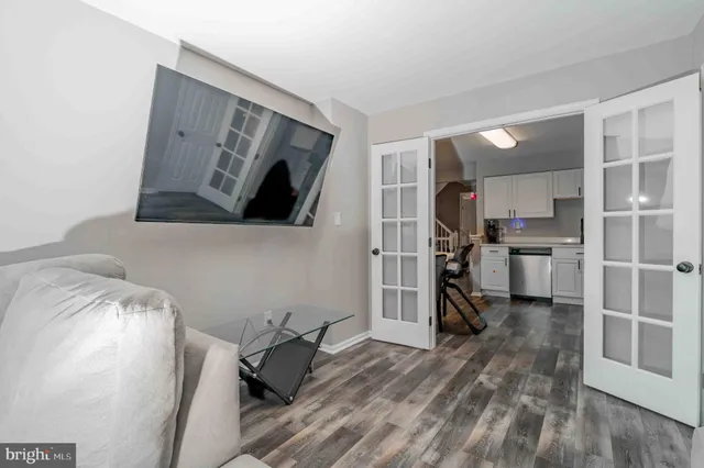 a kitchen with stainless steel appliances a refrigerator and a stove top oven