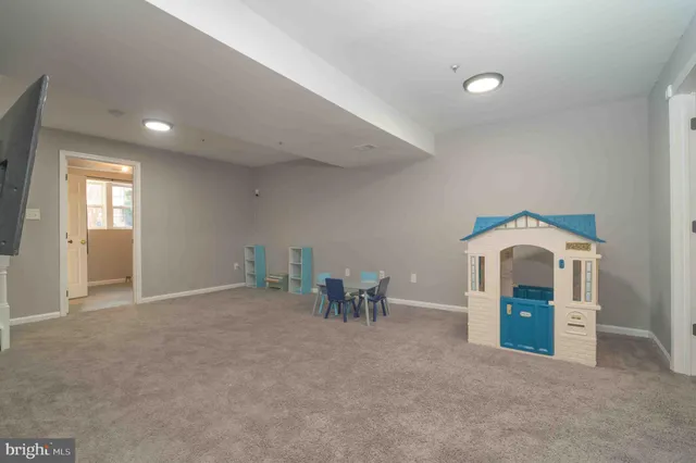 a view of a livingroom with furniture and chandelier