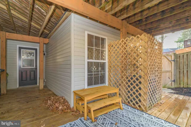 a view of a door and wooden floor