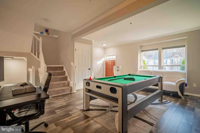 a room with furniture and wooden floor