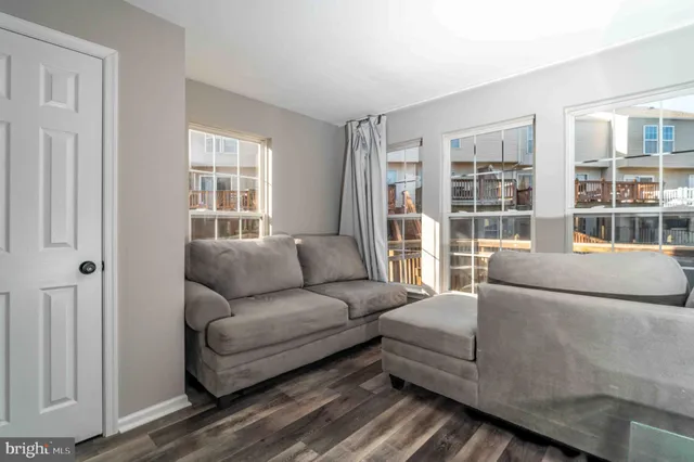 a living room with furniture and windows