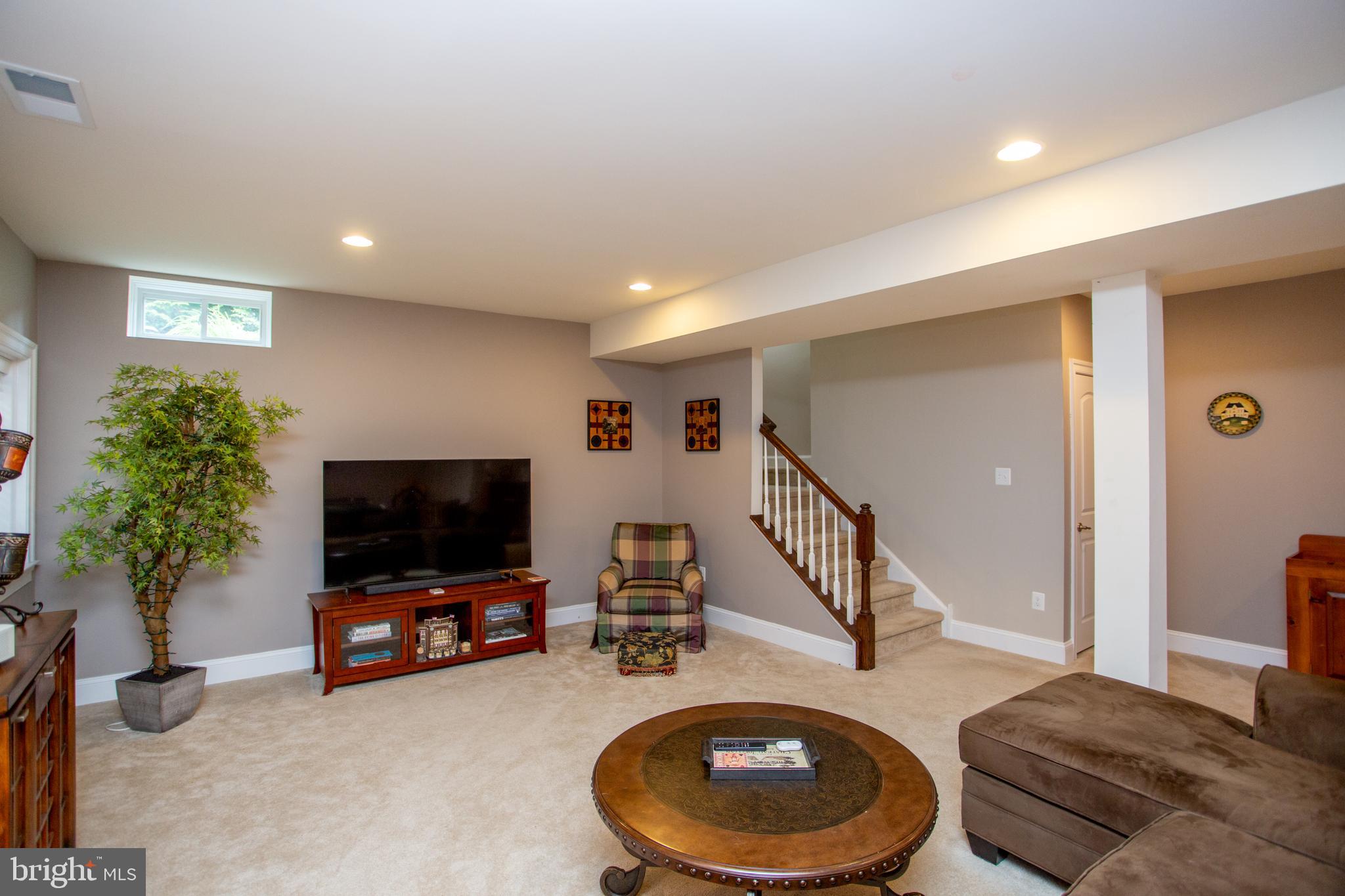 4682 Plough Tavern Road Doylestown, PA 18902 - Photo 35 of 42 a living room with furniture and a flat screen tv