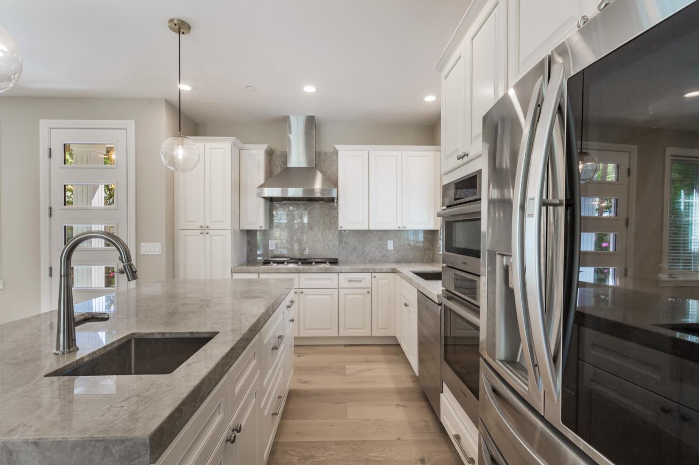 11 A Cowell Lane Atherton, CA 94027 - Photo 14 of 35 a kitchen with kitchen island granite countertop a sink stainless steel appliances and cabinets