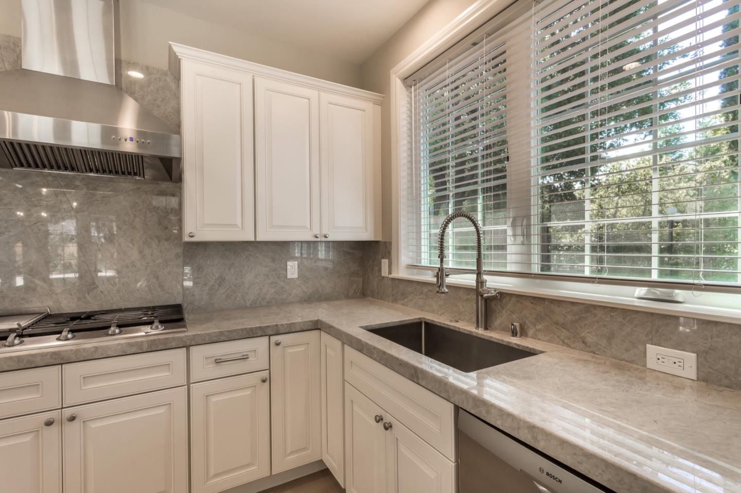 11 A Cowell Lane Atherton, CA 94027 - Photo 15 of 35 a kitchen with granite countertop a sink and a white wooden cabinets