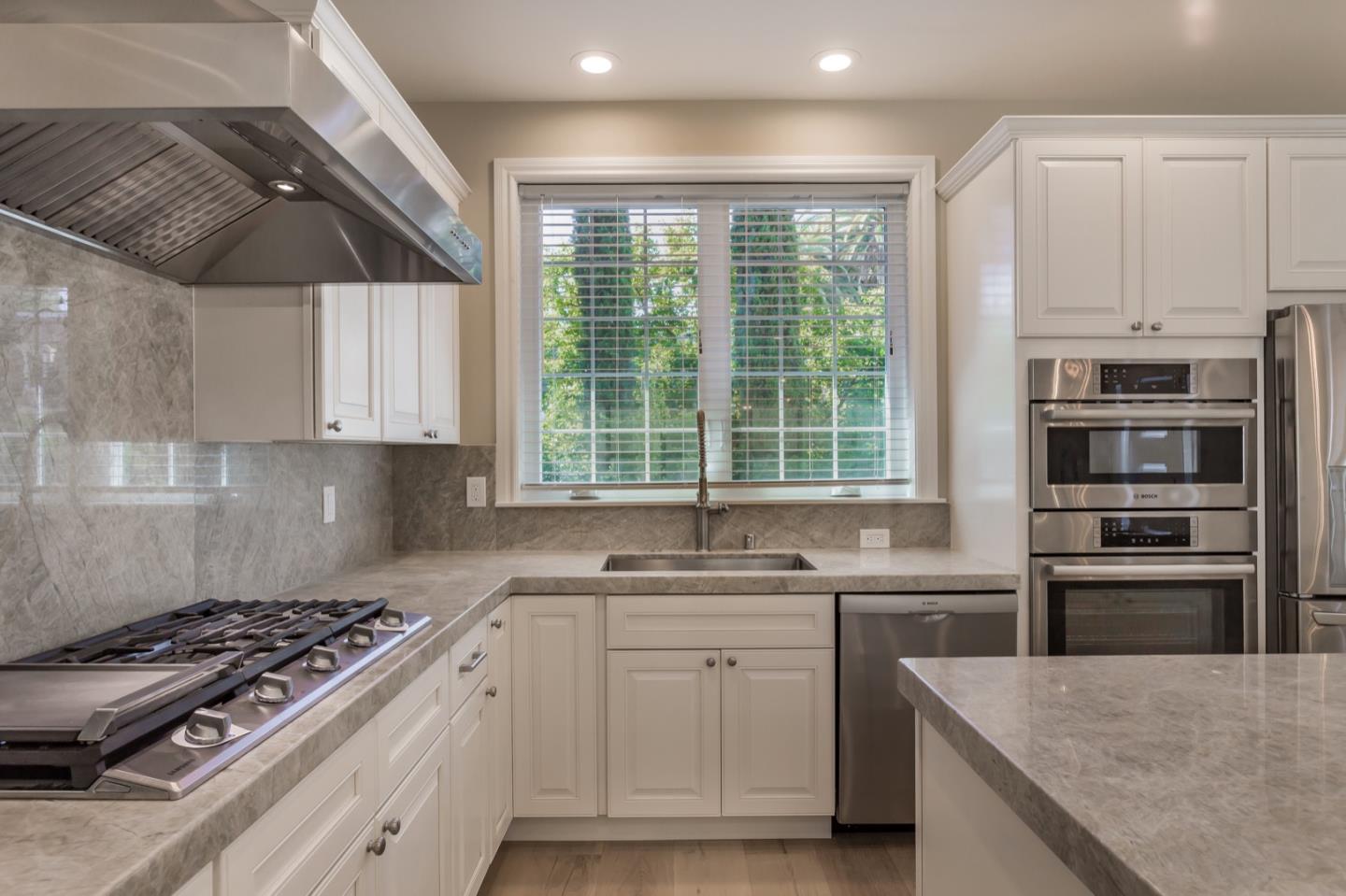11 A Cowell Lane Atherton, CA 94027 - Photo 17 of 35 a kitchen with a sink stove and cabinets