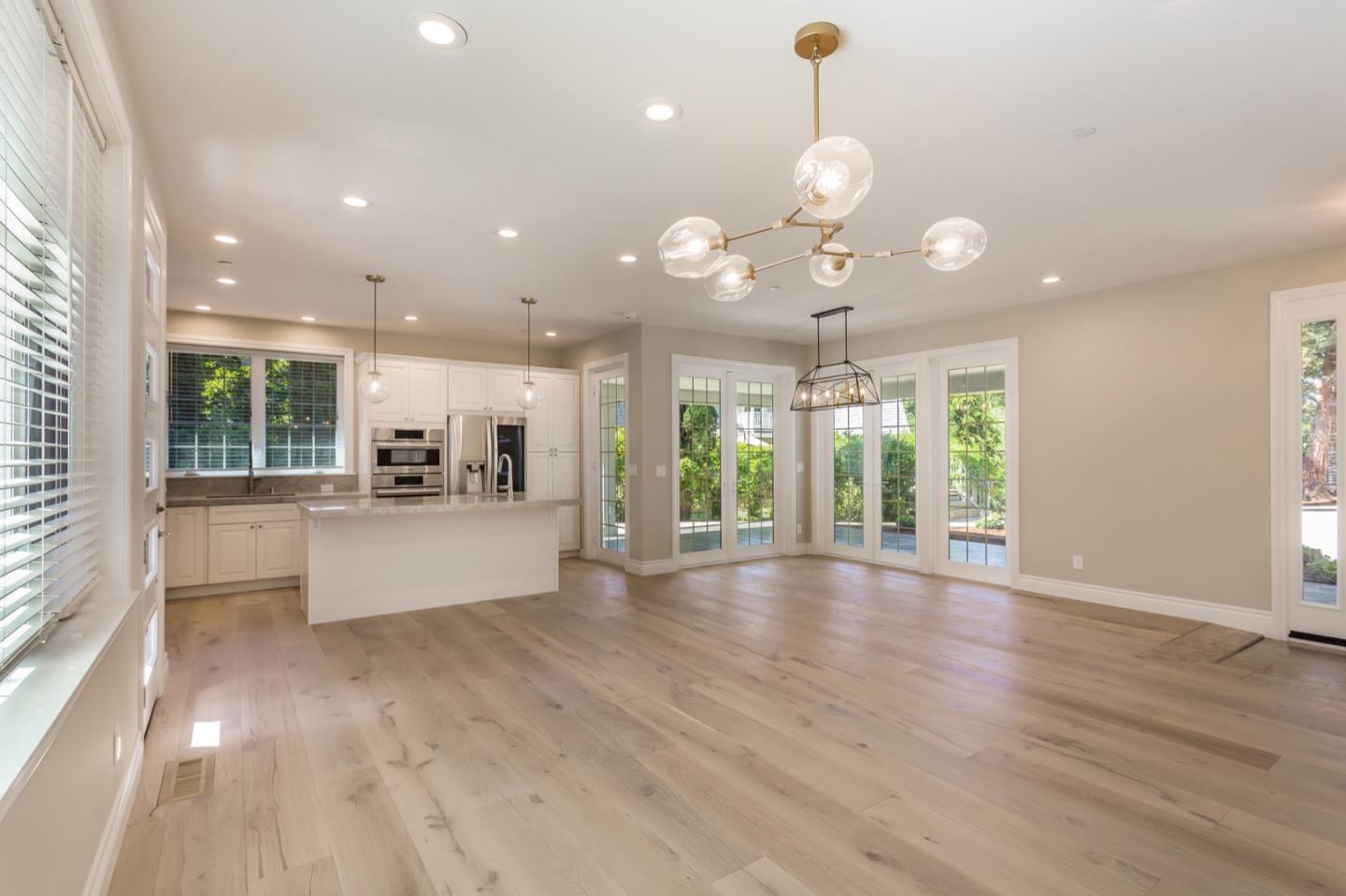 11 A Cowell Lane Atherton, CA 94027 - Photo 7 of 35 a view of a kitchen with granite countertop a stove a large window with wooden floor
