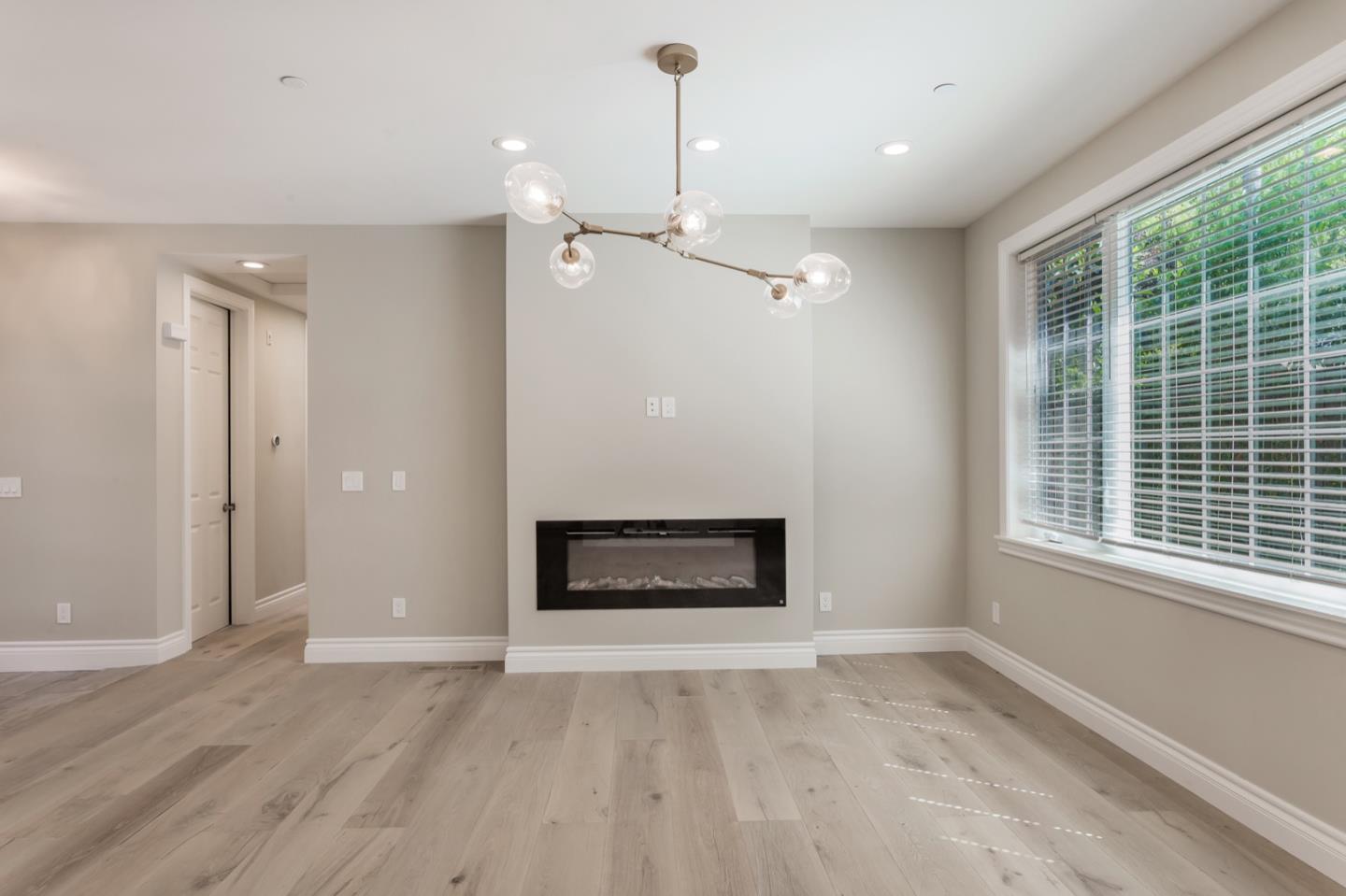 11 A Cowell Lane Atherton, CA 94027 - Photo 9 of 35 an empty room with fireplace and windows