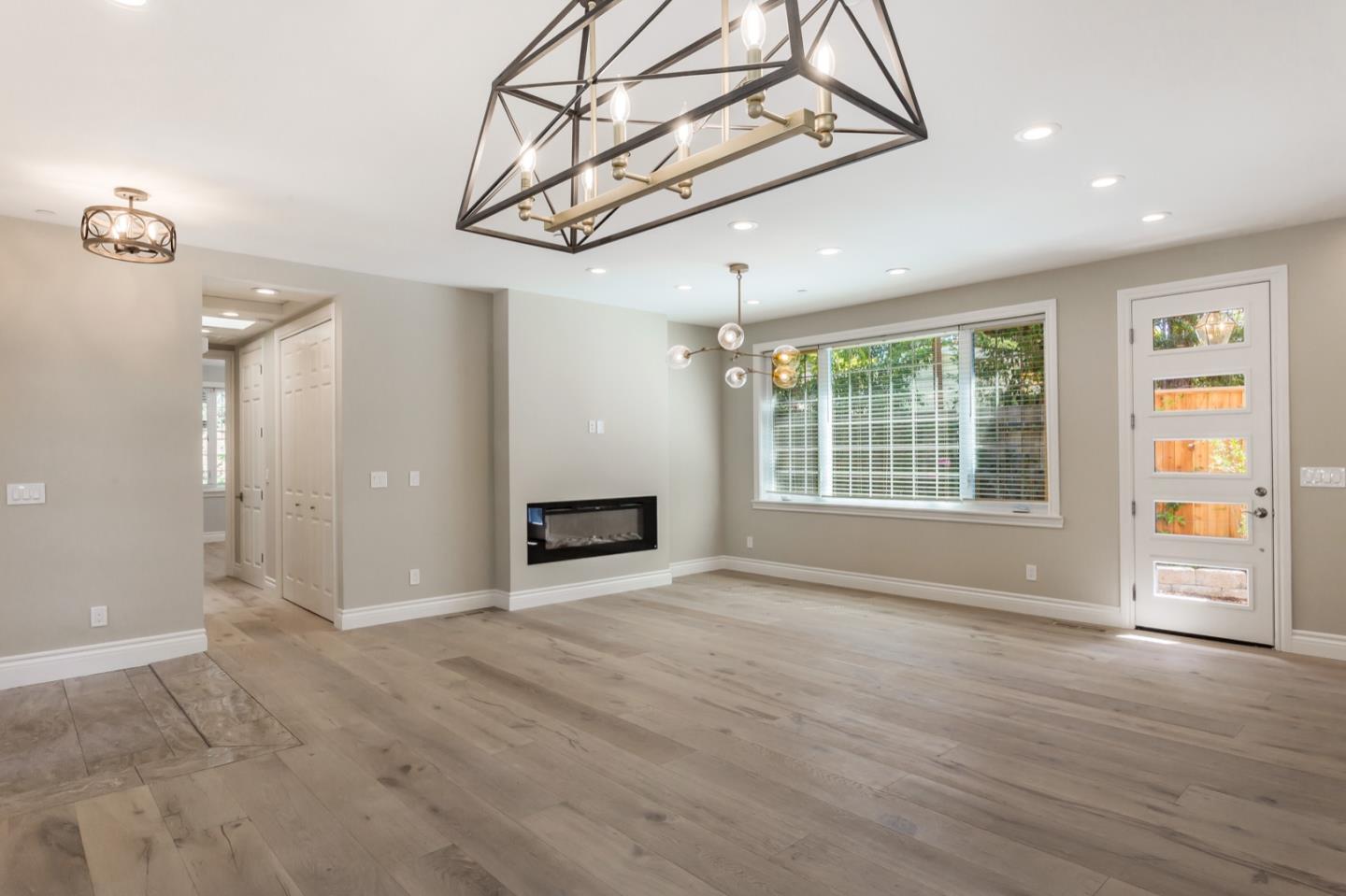 11 A Cowell Lane Atherton, CA 94027 - Photo 10 of 35 a view of an empty room with a window and wooden floor