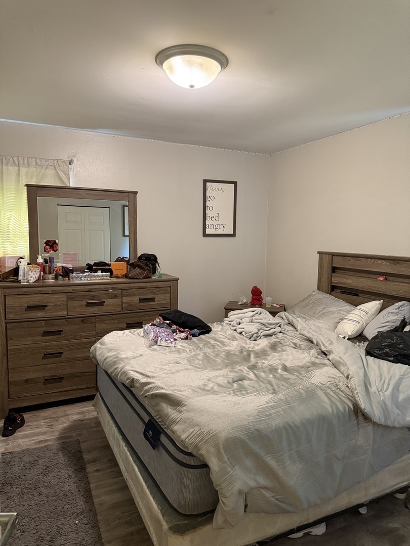 1908 215th Place Sauk Village, IL 60411 - Photo 11 of 11 a bedroom with a bed and a dresser