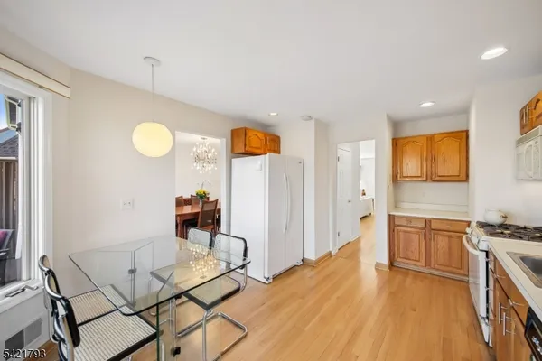 a kitchen that has a table and chairs in it