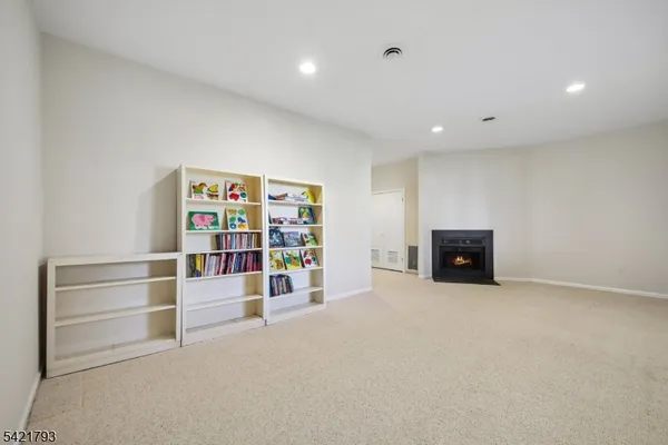 a view of an empty room with shelves