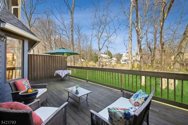 a view of a patio with couple of chairs