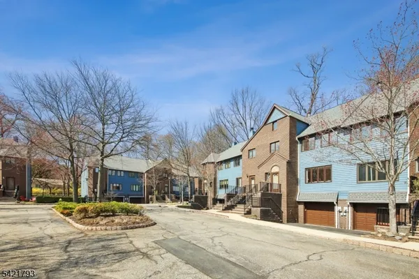 a view of a street with a building in the background