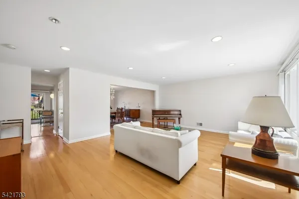 a living room with furniture and a lamp