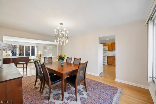a view of a dining room with furniture and window