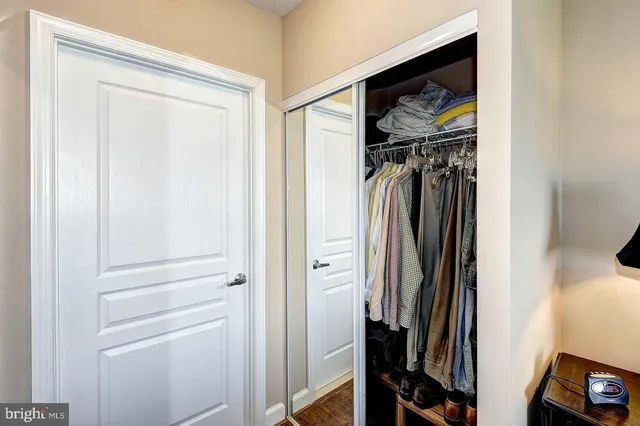 a bed sitting in a bedroom next to a window