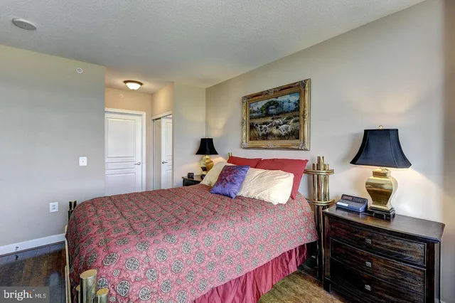 a living room with furniture a fireplace and a chandelier