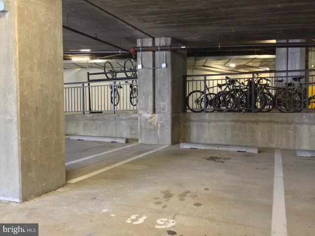 a view of a livingroom with furniture and floor to ceiling window