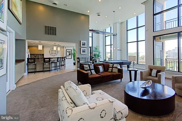 a view of a patio with a table and chairs and couches