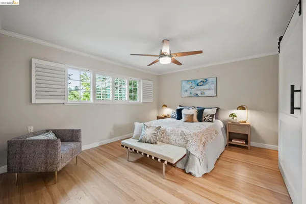 a spacious bedroom with a bed and a couch