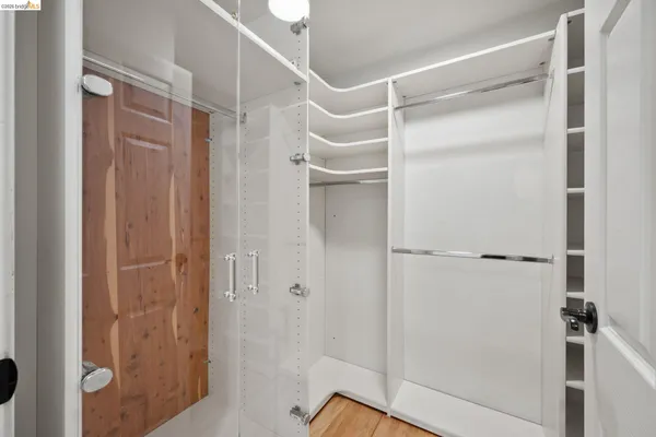 a bathroom with a glass shower door