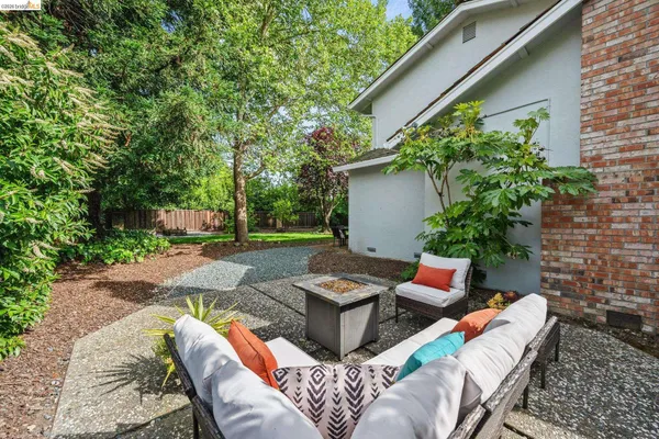 a view of a house with a yard porch and sitting area