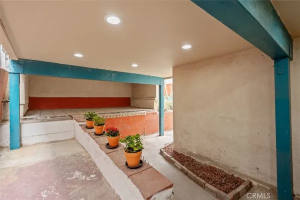 a lobby with furniture and potted plant