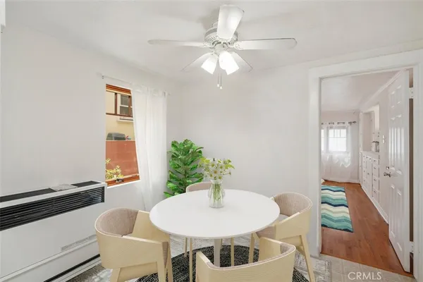 a view of a livingroom with furniture and a potted plant