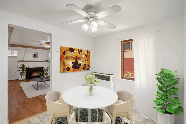 a spacious bathroom with a tub sink and mirror