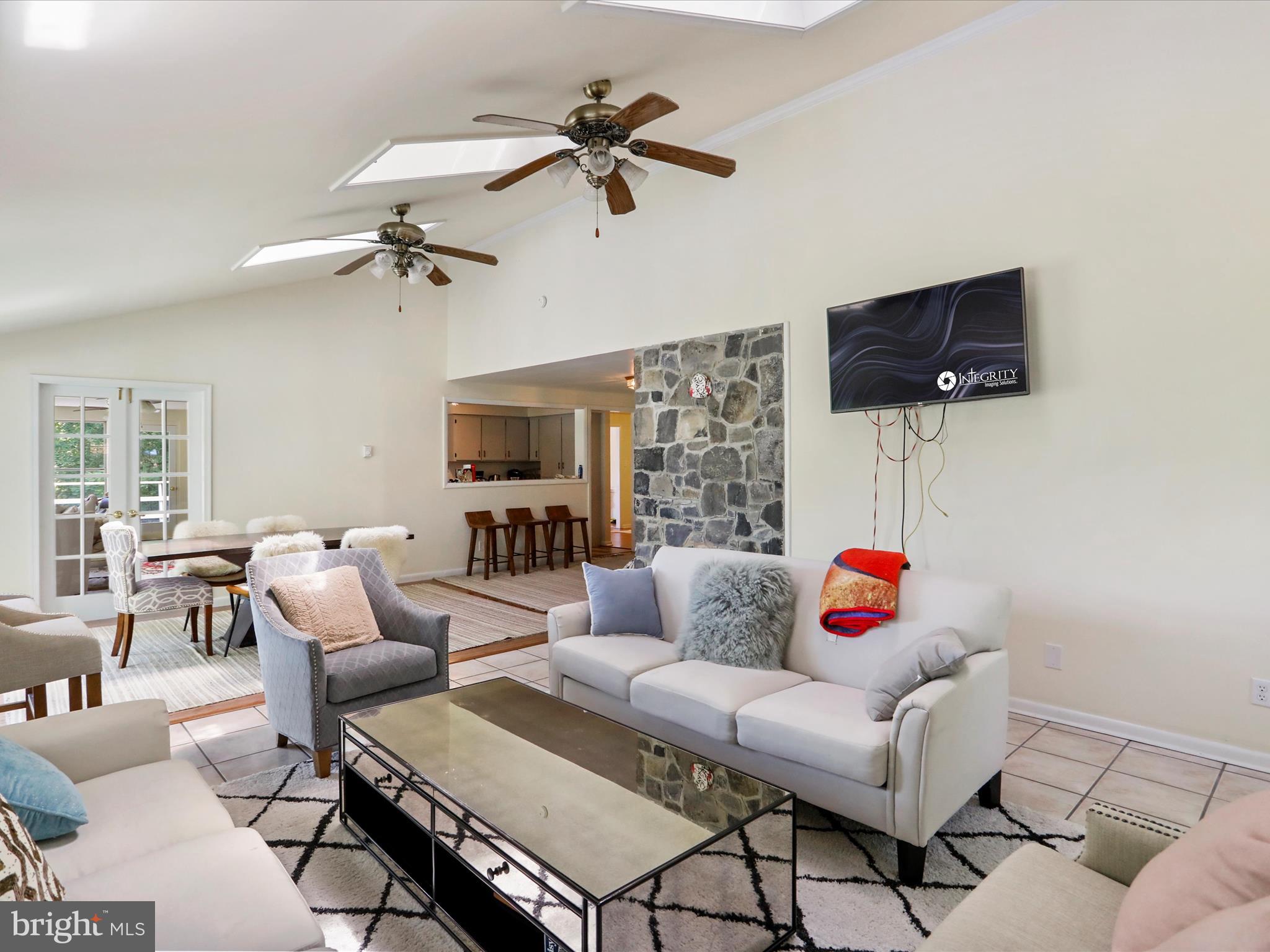 999 Aspero Lane Falling Waters, WV 25419 - Photo 12 of 57 a living room with furniture and a flat screen tv