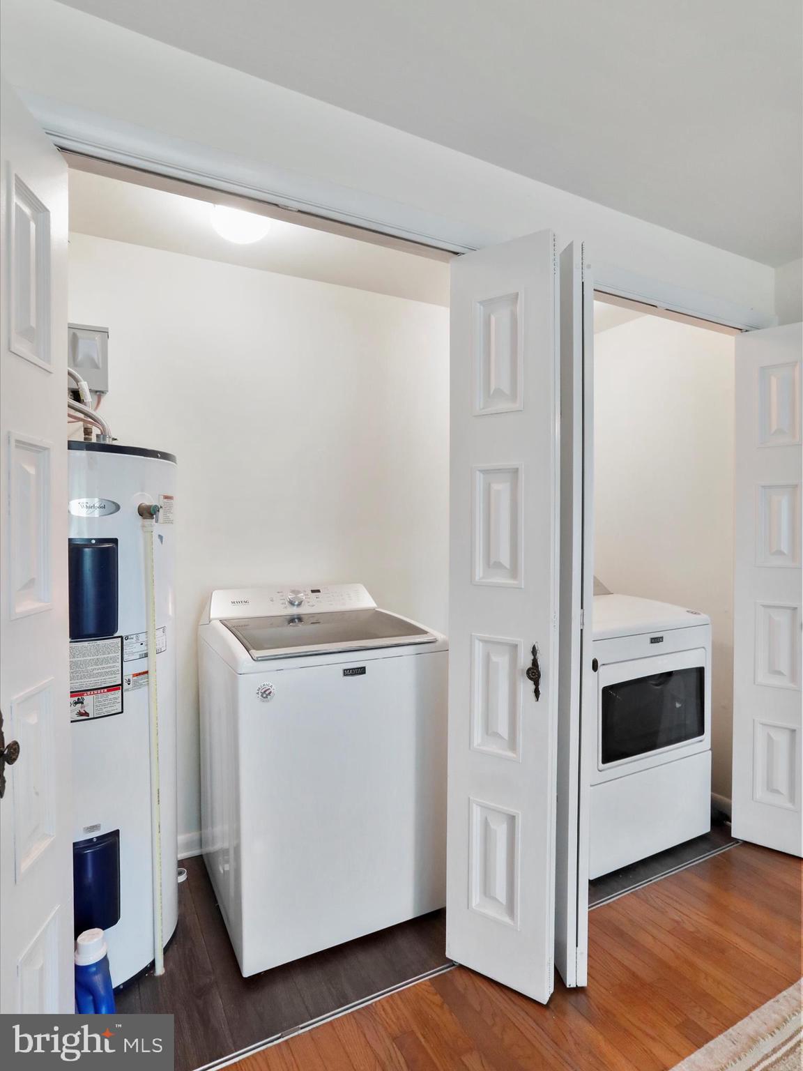 999 Aspero Lane Falling Waters, WV 25419 - Photo 16 of 57 a view of washer and dryer with kitchen in the background