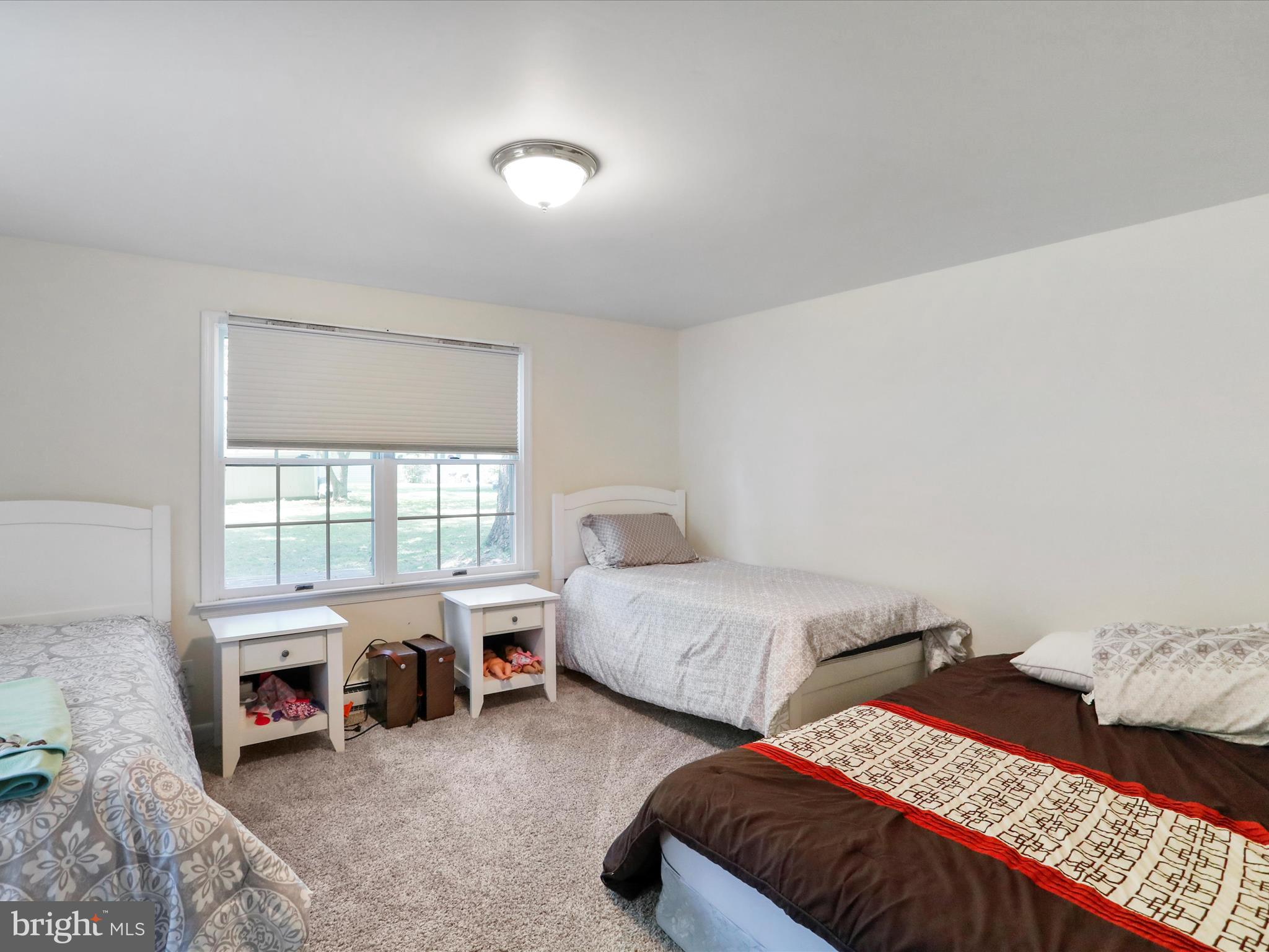 999 Aspero Lane Falling Waters, WV 25419 - Photo 18 of 57 a bedroom with two beds and a window